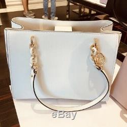white and gold michael kors purse
