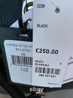 Sac à bandoulière en cuir noir DKNY, prix de vente conseillé de 250 £, avec sac de protection contre la poussière.