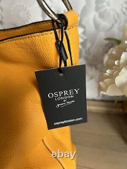 Sac en cuir orange Osprey neuf avec étiquette, prix de vente conseillé de 225 livres.